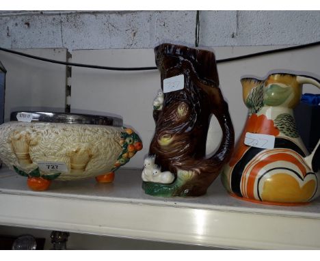 Clarice Cliff Crucus bowl and two jugsCondition:- General wear through age and use, crazing throughout, pitting to chrome aro
