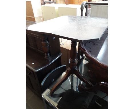 An oak tripod table. 