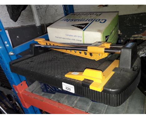 A Boots 2x2 slide projector, a manual tile cutter and two Dewalt cordless drills with batteries - no chargers. 