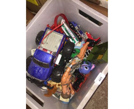 A box of toys to include Action Man, monster truck, etc. 