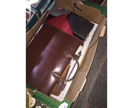A vintage leather music case and other leather goods. 