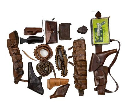 A group of various accessoriesComprising seven various pistol holsters, one with leather strap; two 12-bore cartridge belts; 