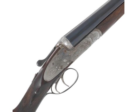 A 12-bore sidelock ejector gun by John Wilkes, no. 12286Foliate scroll engraving, well-figured stock (small crack and chip to