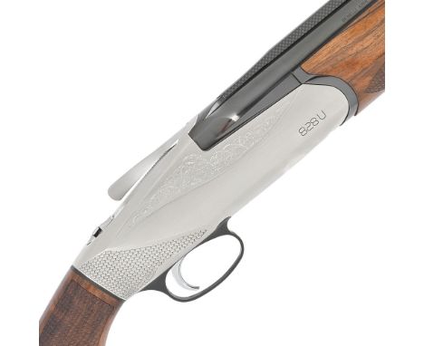 A 12-bore '828U' single-trigger over-and-under ejector gun by Benelli, no. BS02309H17Hold-open top-lever, fully-selective sin