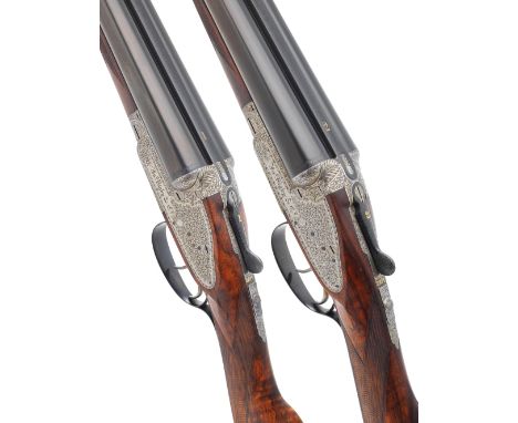 A pair of 12-bore sidelock ejector guns by J. Rigby &amp; Co., no. 17381/2The toplevers and ribs inlaid '1' and '2' in gold, 