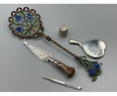 Three silver items to include a thimble, propelling pencil and a small mirror together with a white metal &amp; marble handle