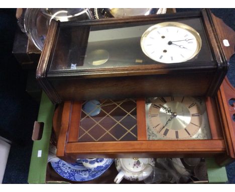 Three boxes of chinaware, plated ware, stationary maps, two wall clocks and a mantle clock.