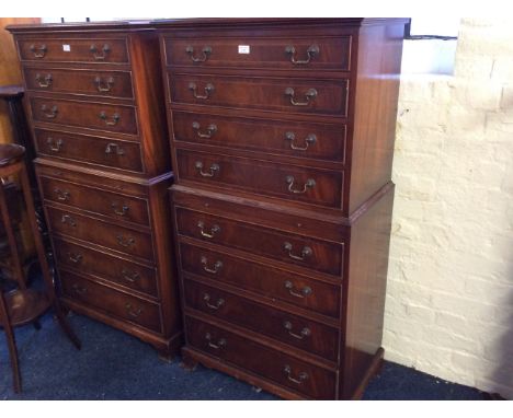 A reproduction mahogany chest on chest, fitted eight drawers on bracket feet by Bradleys.