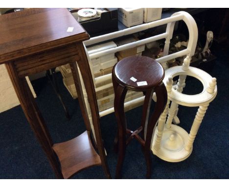 White painted towel rail, white stick stand, circular paint stand, and a mahogany two tier plant stand.