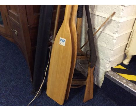 A Collection of various sporting equipment to include daisy children's air rifle, pair of wooden oars and a vintage Slazenger