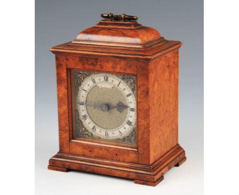 A 20th Century walnut cased mantle clock by John Dyson & Sons Ltd, Leeds, the face having brass spandrels with silver tone ch