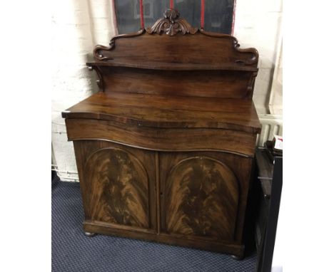 A 19th Century mahogany chiffonier with domed design doors with single long drawer to top with carved shelf back.