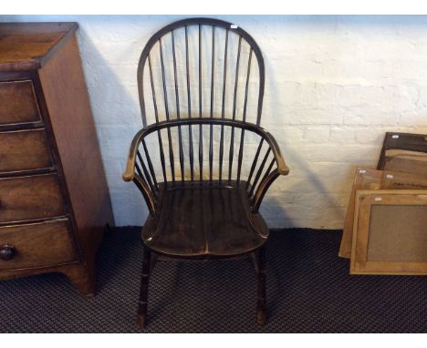 A mahogany Windsor style armchair with stick back.