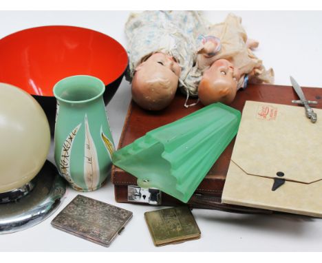 A mixed lot comprising a vintage leather case, two dolls, a Leica negative album, a cigarette case, a vintage compact, a mode