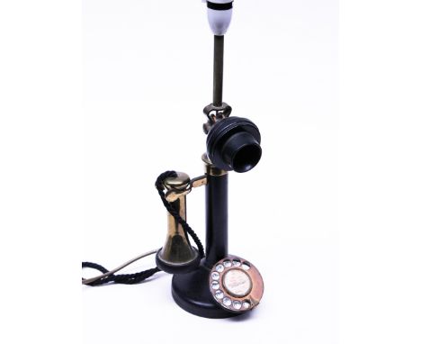 A black bakelite telephone converted to lamp base. H47cm. Condition - general wear to include marks, scratches and pitting to