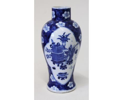 A Chinese porcelain blue and white vase bearing four character Kangxi mark to base. H19cm. Condition - very good, no chips, c