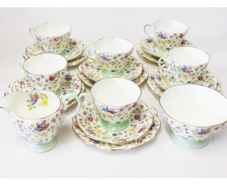 A Foley china tea set consisting six cups, saucers and plates, milk and sugar. Condition - hairline to jug and bowl, I can't 