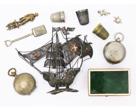 A mixed lot comprising a filigree and enamel gallion, two plated coin cases, a brass and enamel snuff box, two silver thimble