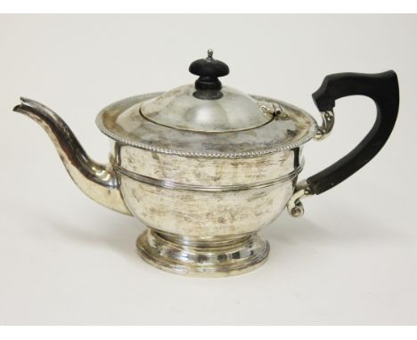 A teapot marked "silver". Gross wt.14oz