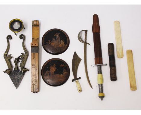 A mix lot to include a Katar style knife or betel nut cracker, a foot measure, two marquetry roundels, three miniature knives