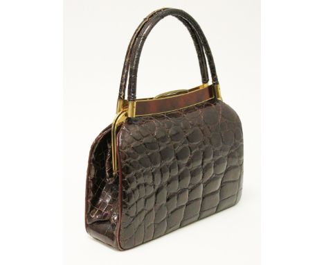 A vintage brass mounted crocodile skin handbag circa 1950s. H36.5cm