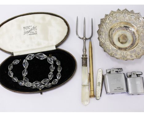 A mixed lot comprising a vintage bead necklace, a bread fork, a gold plated pen, a pen knife, two lighters and a silver dish 