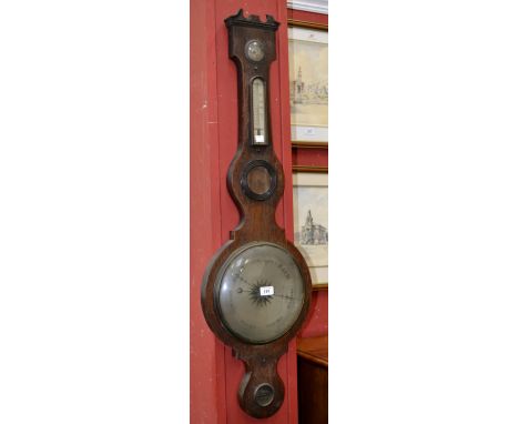 An early 20th century oak wheel barometer.