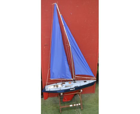 A radio controlled model yacht with challenger 250 radio control unit 