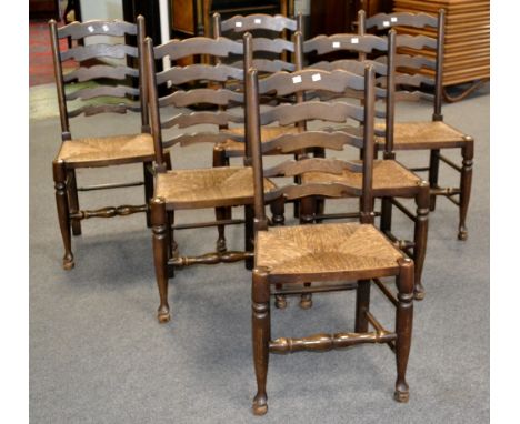 Six ladder back dining chairs, raffia seats, turned forelegs.