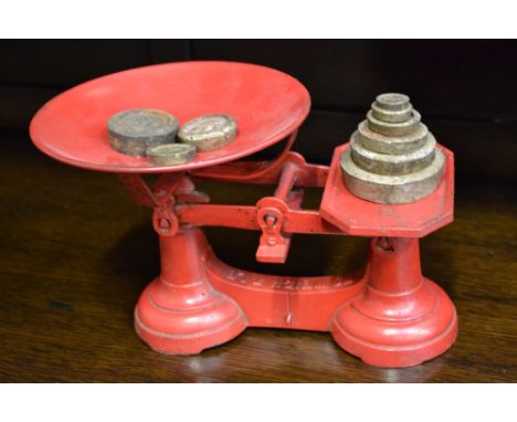 A set of counterbalance kitchen weighing scales and weights.