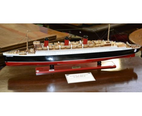 A handcrafted model of the Queen Mary with certificate of authenticity detailing specifications, length 110cm