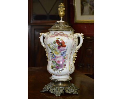 A Victorian floral decorated oil lamp, converted for electricity