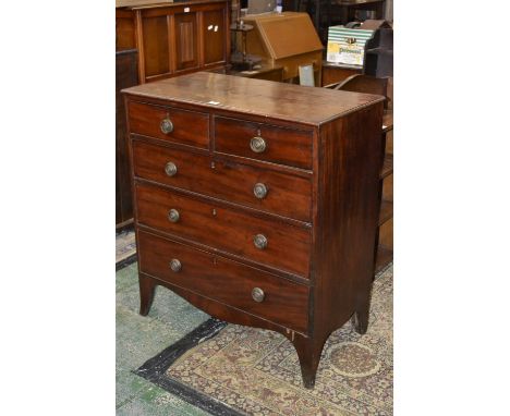 A George III mahogany chest, two short over three long graduated cock beaded drawers, brass rope swing handles, bracket feet,