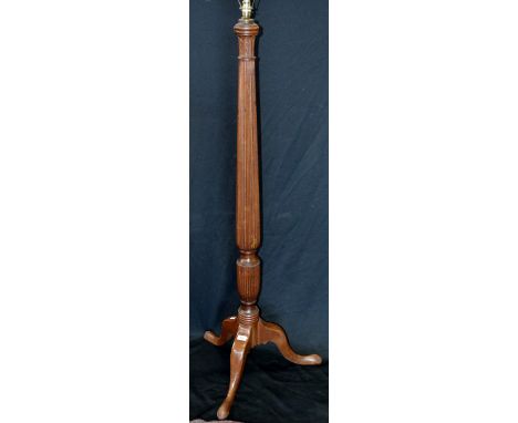 An early 20th century mahogany standard lamp with tapering reeded column, cabriole legs