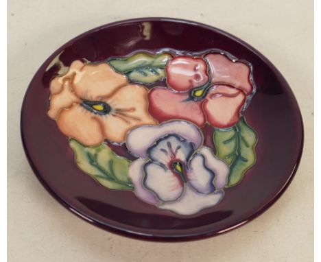 Moorcroft dish Pansy pattern: Measures 10cm, with box.  No damage or restoration, very light crazing. 