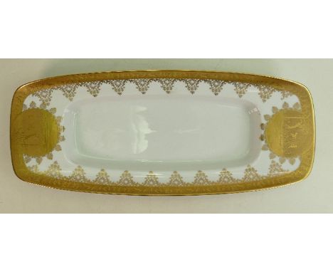 A porcelain long sandwich tray: Gilded all around with various playing fairies, length 46cm x width 17cm, Z Crown mark to bas