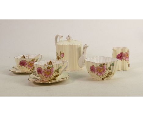 Wileman &amp; Co decorative tea set for two: Gilded embossed floral decoration. Small firing crack to jug and small slither c