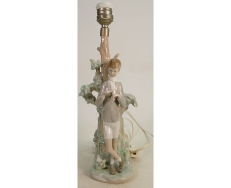 Lladro figural lamp base boy standing by tree: Height 34cm. (Something missing from boys hand). 
