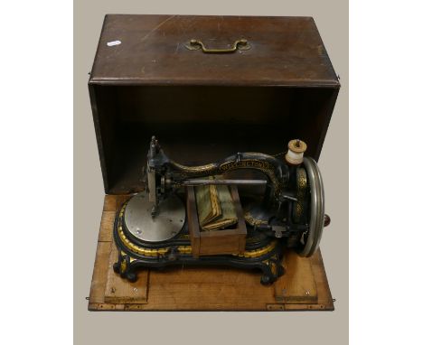 19th century Bradbury &amp; Co Wellington sewing machine in good condition: In wooden case with original operating manual. Le