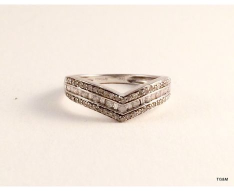 A 9ct white gold diamond Chanel set ladies ring size o