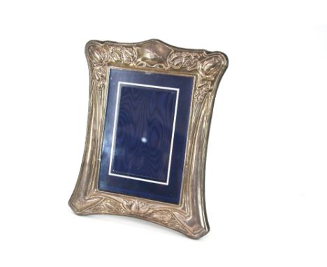 An Art Nouveau style silver photo frame with stylised floral decoration, Sheffield 1989, 25cm x 21cm