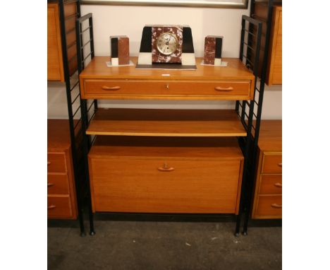 A Ladderax unit comprising drop front cupboard, book shelf and single drawer