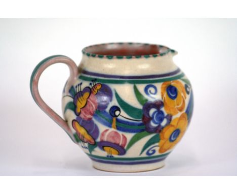 A Carter Stabler Adams Poole pottery jug, typically decorated with colourful flowers on off white ground, 11.5cm