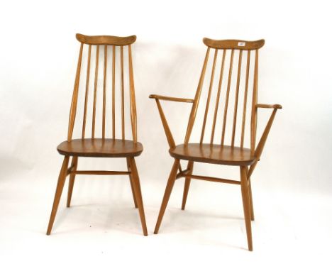 A set of four light Ercol dining chairs, two standards, two carvers, 97cm