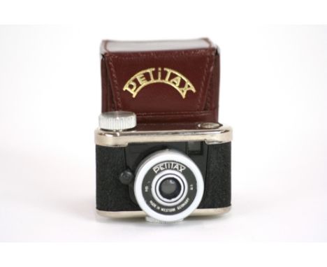 A miniature Petitax camera, 3.5cm x 5.5cm with leather carrying case