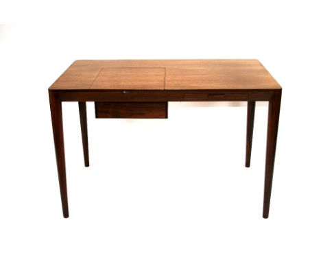 A rosewood dressing table with lift up section enclosing mirror and fitted interior, fitted single drawer below, raised on ro