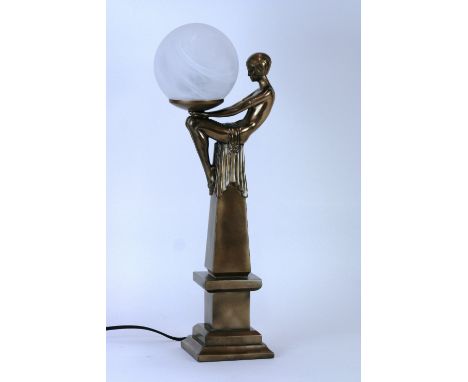 An Art Deco style figural table lamp with circular glass shade, 50cm high in extremes