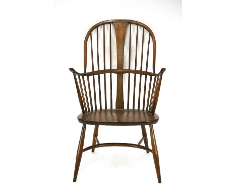A pair of Ercol stick back elbow chairs, 108cm high