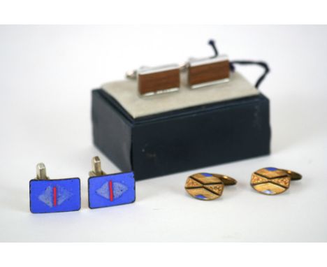 A pair of Massino Dutti cufflinks; a pair of Art Deco cufflinks with blue and black enamel decoration and another pair of cuf