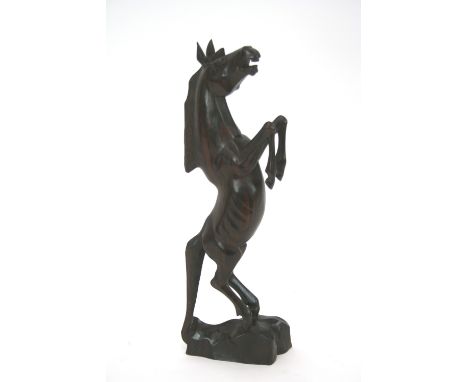 A carved hardwood model horse, 46.5cm